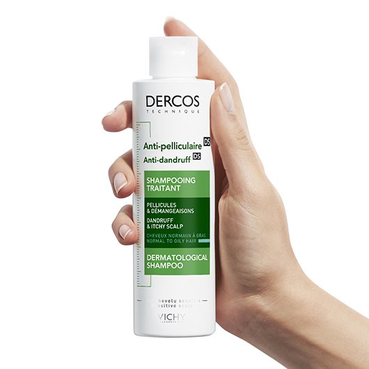 Hand Holding a Bottle of Dercos Anti-Dandruff DS Shampoo